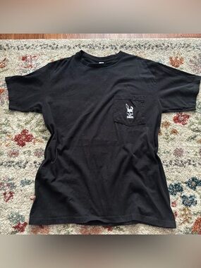 Unisex Black Icarus Bell Tee with White Bunny Skull Graphic on Pocket